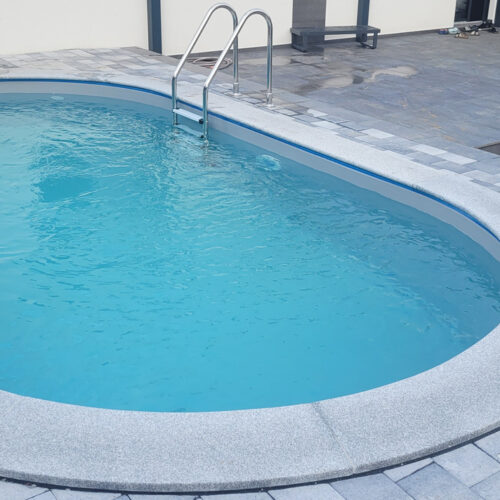 Cranpool Miami Ovalpool mit hellgrauer Pflasterung